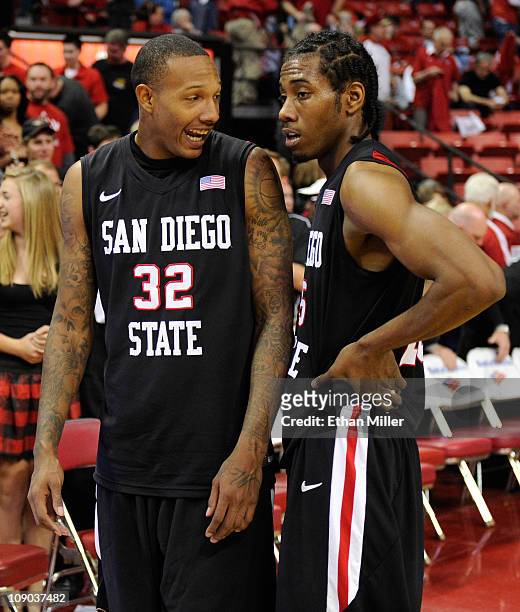 Billy White and and Kawhi Leonard of the San Diego State Aztecs celebrate their 63-57 victory over the UNLV Rebels at the Thomas & Mack Center...