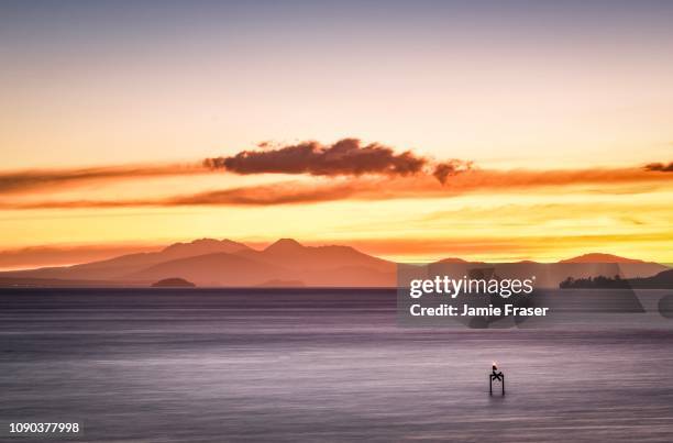 mount tongariro view at sunset on lake taupo - taupo stock pictures, royalty-free photos & images