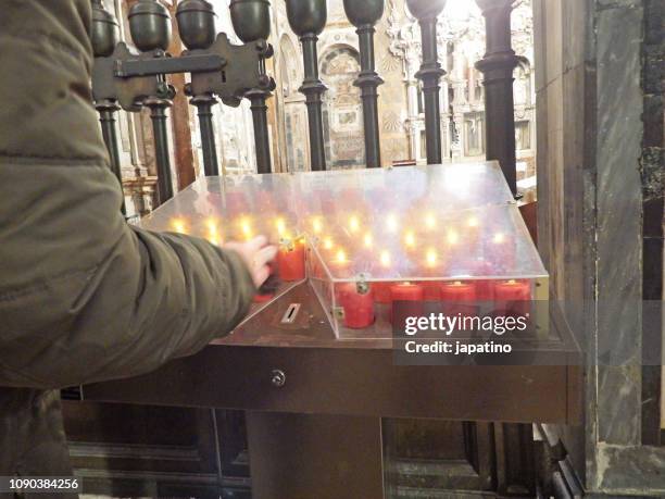 box of alms with electric candles. cathedral of santiago de compostela - alms stock pictures, royalty-free photos & images