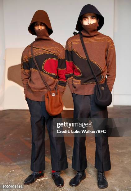 Models pose at the Omar Afridi presentation at the DiscoveryLAB during London Fashion Week Men's January 2019 at the BFC Designer Showrooms on...