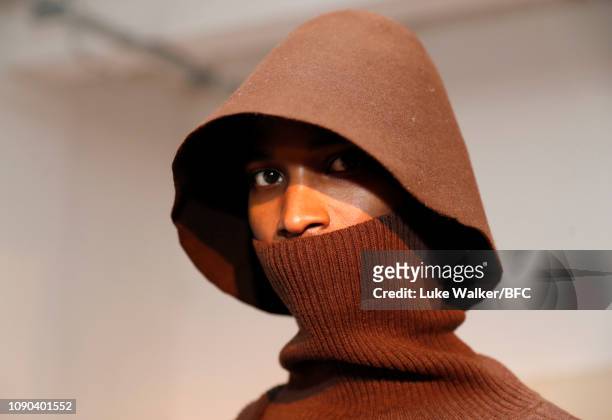 Model poses at the Omar Afridi presentation at the DiscoveryLAB during London Fashion Week Men's January 2019 at the BFC Designer Showrooms on...