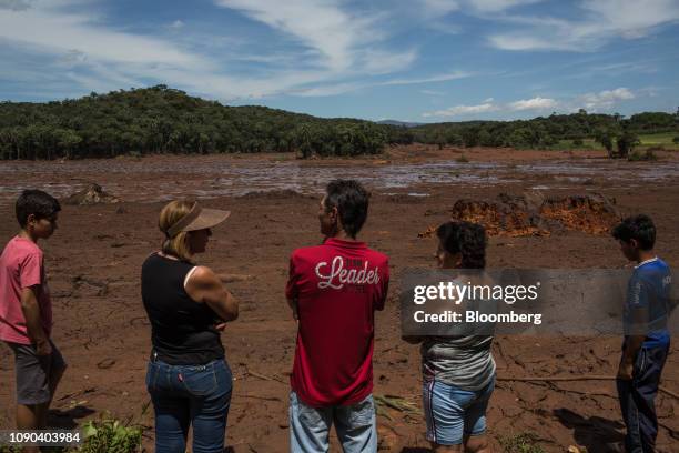 Residents survey damage after a Vale SA dam burst in Brumadinho, Minas Gerais state, Brazil, on Sunday, Jan. 27, 2019. Brazil authorities suspended...