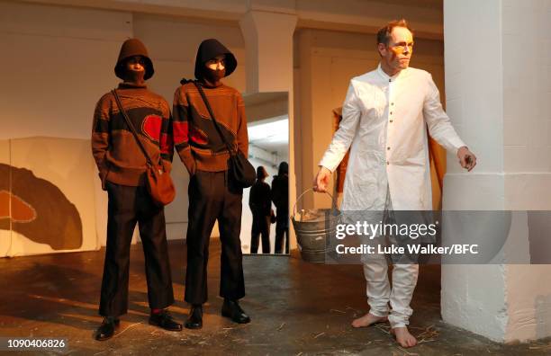 Models pose at the Omar Afridi presentation at the DiscoveryLAB during London Fashion Week Men's January 2019 at the BFC Designer Showrooms on...