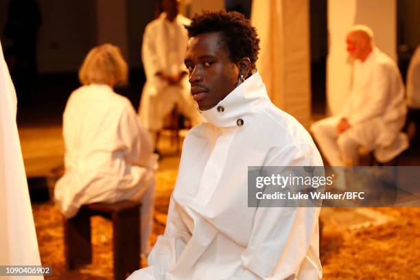 Model poses at the Omar Afridi presentation at the DiscoveryLAB during London Fashion Week Men's January 2019 at the BFC Designer Showrooms on...