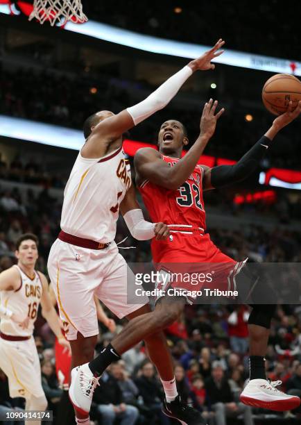 Chicago Bulls guard Kris Dunn misses a shot in the final minute against Cleveland Cavaliers guard Rodney Hood on Sunday, Jan. 27, 2019 at the United...