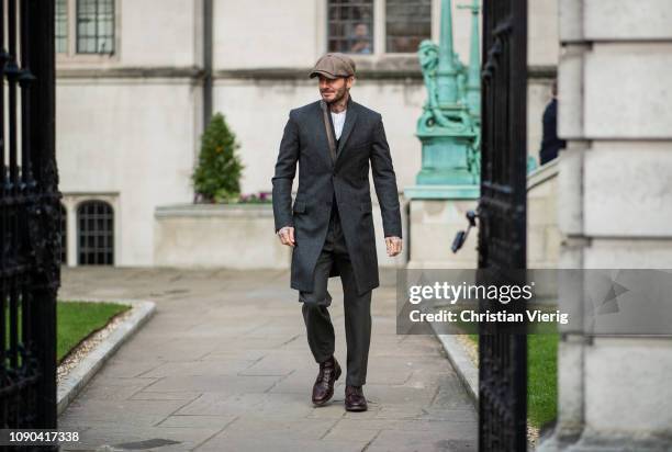 David Beckham is seen outside Kent & Curwen wearing flat cap, wool coat during London Fashion Week Men's January 2019 on January 06, 2019 in London,...