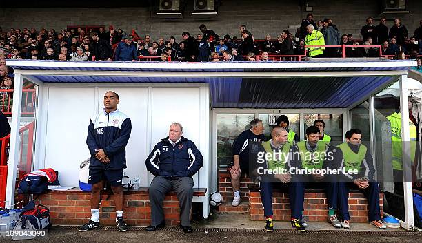 Manager Steve Evans sits on the bench with the substitutes during the Blue Square Bet Premier match between Crawley Town and Wrexham at Broadfield...