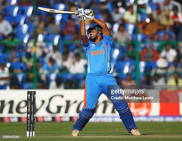 Yusuf Pathan of India edges the ball towards the boundary during the 2011 ICC World Cup Warm up game between India and Australia at the M....