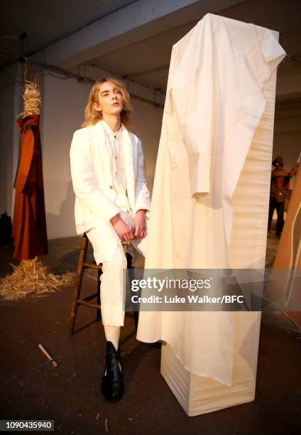 Model poses at the Omar Afridi presentation at the DiscoveryLAB during London Fashion Week Men's January 2019 at the BFC Designer Showrooms on...