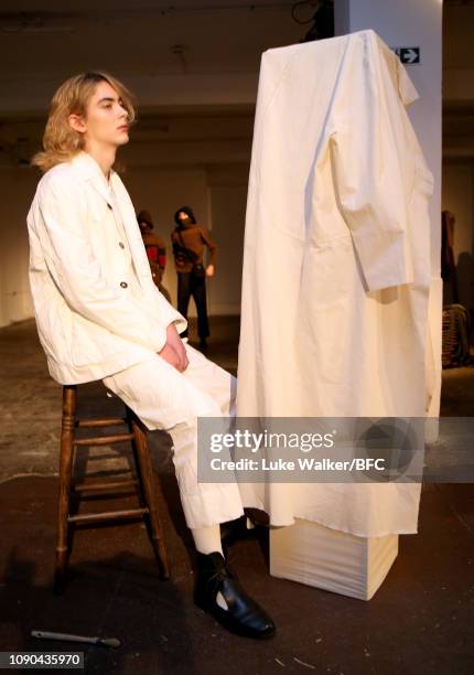 Model poses at the Omar Afridi presentation at the DiscoveryLAB during London Fashion Week Men's January 2019 at the BFC Designer Showrooms on...