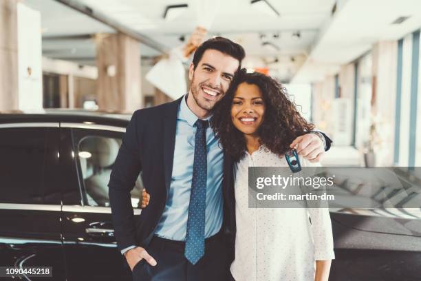 mixed race couple buying new car - new husband stock pictures, royalty-free photos & images