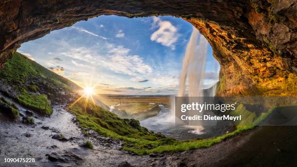 seljalandfoss waterfall in summer time at sunset,  iceland - southern rock stock pictures, royalty-free photos & images