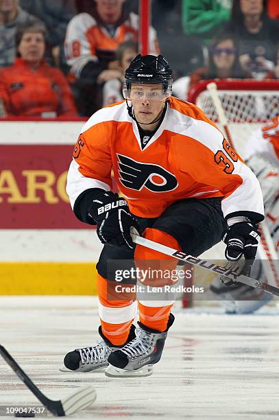 Darroll Powe of the Philadelphia Flyers skates after the puck against the Carolina Hurricanes on February 10, 2011 at the Wells Fargo Center in...