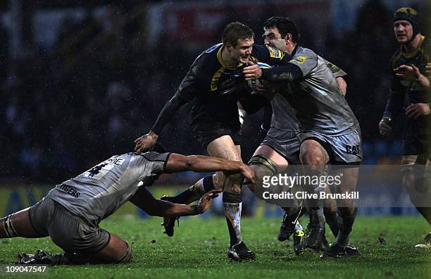 Michael Stephenson of Leeds Carnegie attempts to avoid a challenge from Steve Mafi and Alesana Tuilagi of Leicester Tigers during the AVIVA...