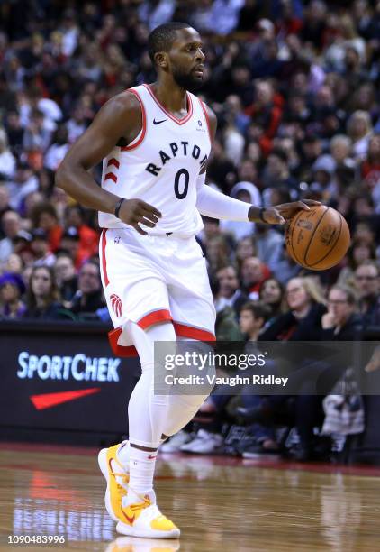 Miles of the Toronto Raptors dribbles the ball during the first half of an NBA game against the Utah Jazz at Scotiabank Arena on January 1, 2019 in...