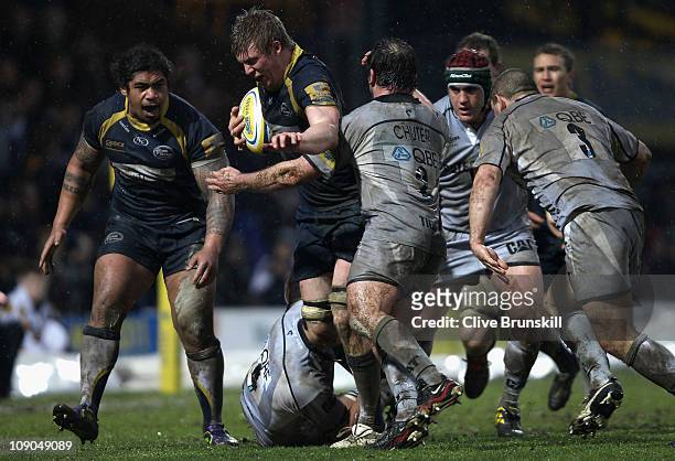 James Craig of Leeds Carnegie is tackled by George Chuter of Leicester Tigers during the AVIVA Premiership match between Leeds Carnegie and Leicester...