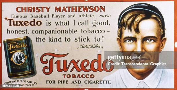 Christy Mathewson, pitcher for the New York Giants, appears on a trolley car sign advertising Tuxedo tobacco, issued circa 1910 in New York City.