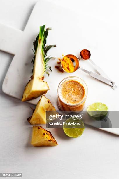 turmeric and pineapple smoothies,detox morning juice drink - detox diet stock pictures, royalty-free photos & images