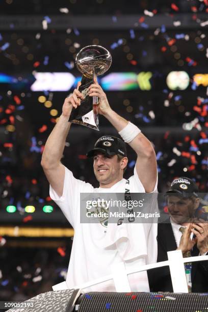 Aaron Rodgers of the Green Bay Packers holds up the Vince Lombardi Trophy after winning Super Bowl XLV 31-25 against the Pittsburgh Steelers at...