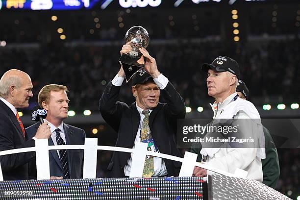President and CEO of the Green Bay Packers Mark Murphy holds up the Vince Lombardi Trophy after winning Super Bowl XLV against the Pittsburgh...