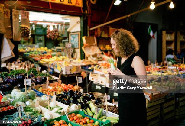 woman looking at fresh produce stall in palermo - italian market stock pictures, royalty-free photos & images