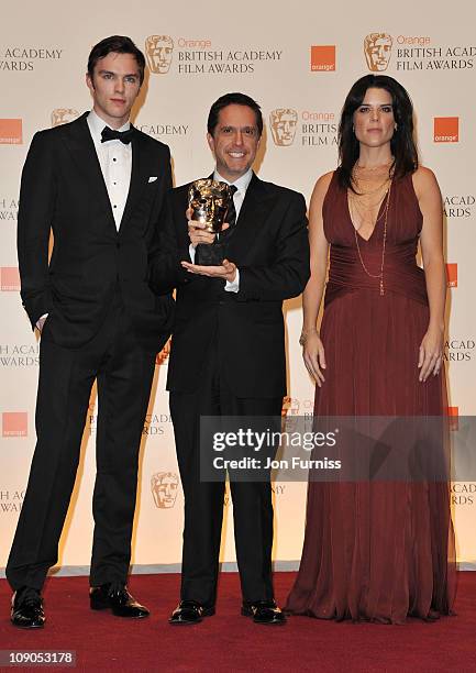 Presenters Nicholas Hoult and Neve Campbell pose with Lee Unkrich, winner of the award for Animated Film for the film "Toy Story 3", during the 2011...