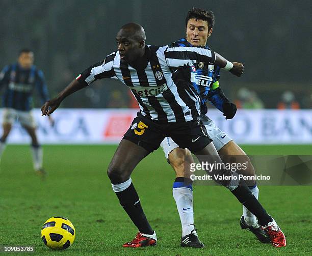 Mohamed Lamine Sissoko of Juventus FC is challenged by Javier Zanetti of FC Internazionale Milano during the Serie A match between Juventus FC and FC...