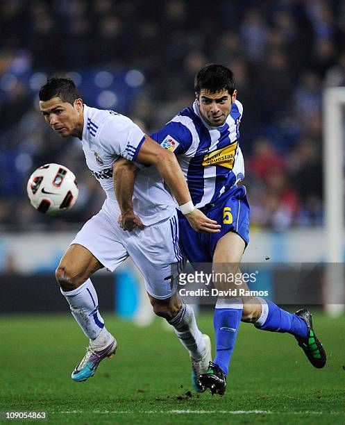 Cristiano Ronaldo of Real Madrid duels for the ball against Jordi Amat of RCD Espanyol during La Liga match between RCD Espanyol and Real Madrid at...