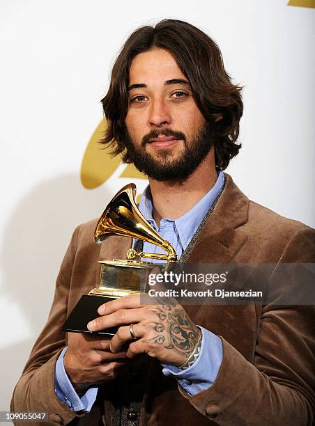 Songwriter Ryan Bingham, winner of the Best Song Written For Motion Picture, Television Or Other Visual Media award for "'The Weary Kind' " poses in...