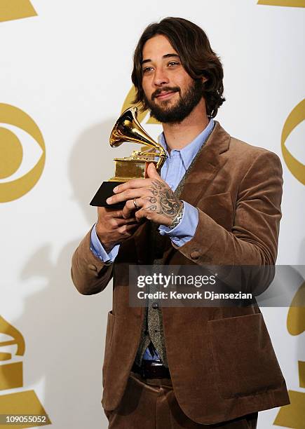 Songwriter Ryan Bingham, winner of the Best Song Written For Motion Picture, Television Or Other Visual Media award for "'The Weary Kind' " poses in...