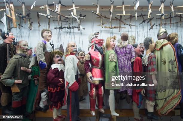 December 2018, Saxony, Dresden: Various marionettes hang next to each other in the marionette room of the puppet theatre collection. One of the most...