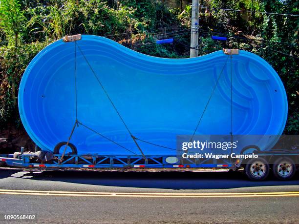 fiberglass pool transportation - fibreglass stock pictures, royalty-free photos & images