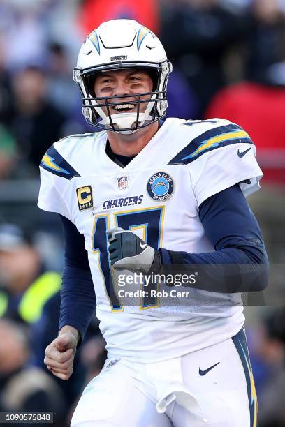 Philip Rivers of the Los Angeles Chargers celebrates after throwing a two point conversion to Mike Williams against the Baltimore Ravens during the...