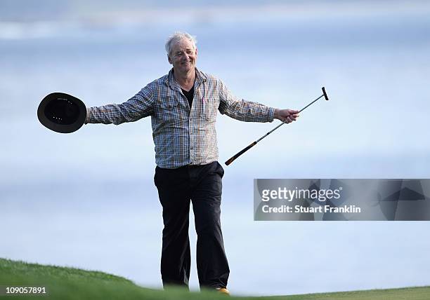 Actor Bill Murray celebrates on the 18th hole during the final round of the AT&T Pebble Beach National Pro-Am at Pebble Beach Golf Links on February...