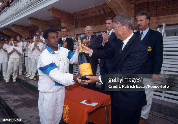 Kent batsman Aravinda de Silva is presented with the man of the match award by Gallaher managing director Peter Veen after the Benson and Hedges Cup...