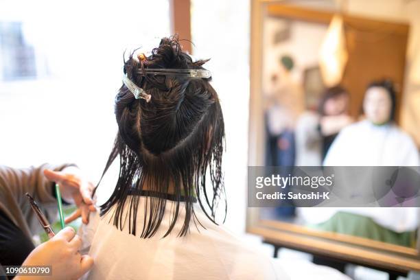 woman cutting hair in comfortable hair salon - short hair cut stock pictures, royalty-free photos & images