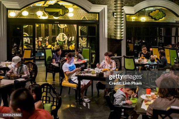 Guests have dinner at a restaurant inside the five-star InterContinental Danang Sun Peninsula Resort, one of the potential place where Donald Trump &...