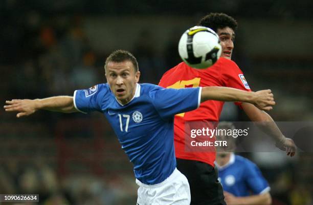 Belgian Marouane Fellaini and Estonia's Enar Jaager vie for the ball during the World Cup 2010 qualification match Belgium versus Estonia,on...