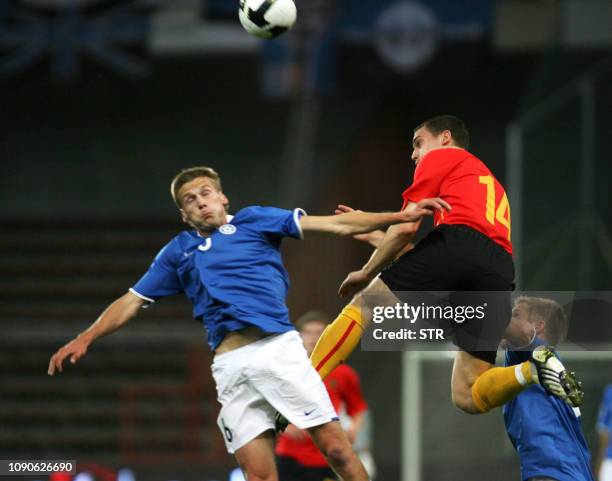 Belgian Thomas Vermaelen and Estonia's Aleksandr Dmitrijev vie for the ball during the World Cup 2010 qualification match Belgium versus Estonia,on...