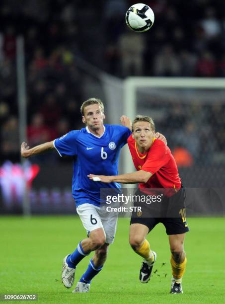 Belgian Wesley Sonck and Estonia's Aleksandr Dmitrijev vie for the ball during the World Cup 2010 qualification match Belgium versus Estonia,on...