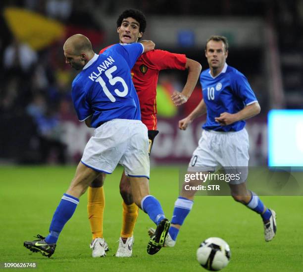 Belgian Marouane Fellaini and Estonia's Ragnar Klavan vie for the ball during the World Cup 2010 qualification match Belgium versus Estonia,on...