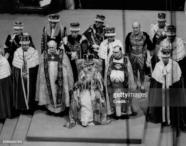 Britain's Queen Elizabeth II sits on a throne during her coronation in Westminster Abbey in London.