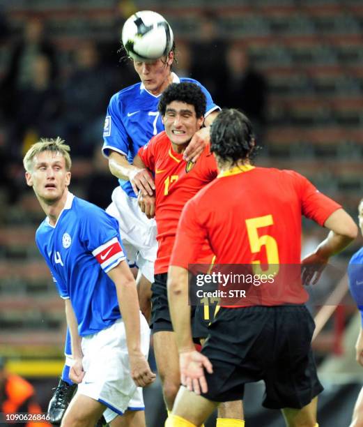 Belgian Marouane Fellaini and Estonia's Raio Piiroja and Alo Barengrub head the ball during the World Cup 2010 qualification match Belgium versus...