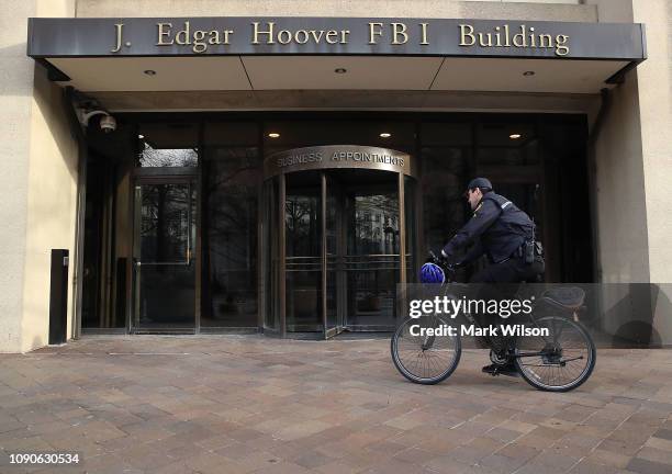 Law enforcement officer arrives at the J. Edgar Hoover FBI Building on January 28, 2019 in Washington, DC. Last Friday President Donald Trump signed...