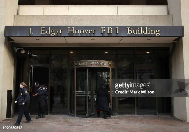 Law enforcement officers walk out of the J. Edgar Hoover FBI Building on January 28, 2019 in Washington, DC. Last Friday President Donald Trump...