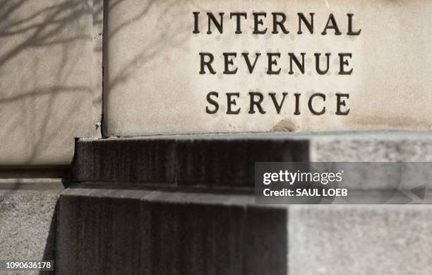 The US Internal Revenue Service building is seen on the first work day for furloughed federal workers following a 35-day partial government shutdown...