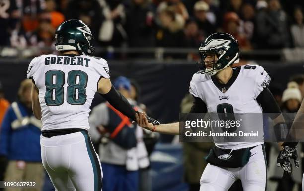 Dallas Goedert and Nick Foles of the Philadelphia Eagles celebrate a touchdown against the Chicago Bears in the third quarter of the NFC Wild Card...