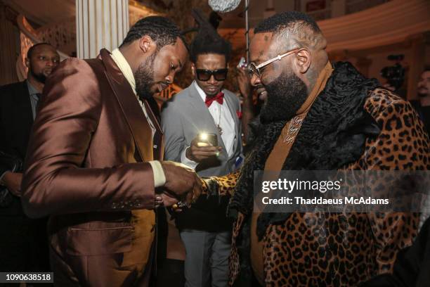 Meek Mill gifts Rick Ross a Diamond bracelet at his birthday dinner on January 27, 2019 in Fayetteville, Georgia.