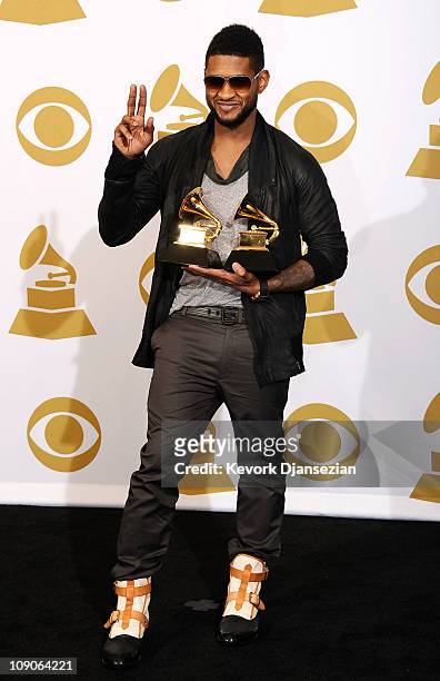 Musician Usher, winner of the Best Male R&B Vocal Performance award for "There Goes My Baby" and the Best Contemporary R&B Album award for "Raymond...