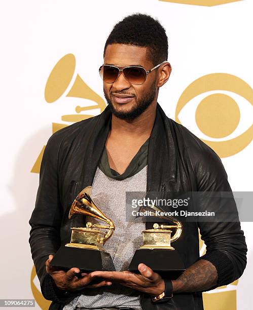 Musician Usher, winner of the Best Male R&B Vocal Performance award for "There Goes My Baby" and the Best Contemporary R&B Album award for "Raymond...